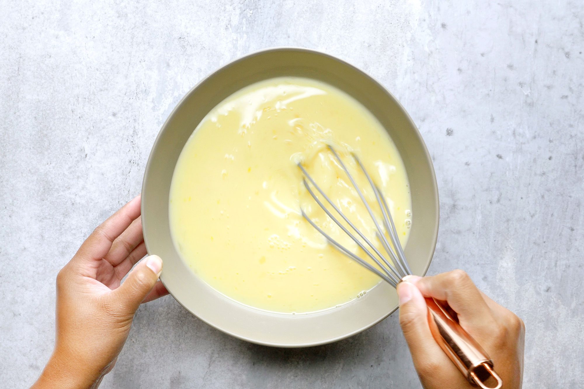 In a large bowl, beat the eggs, milk, vanilla and the remaining sugar