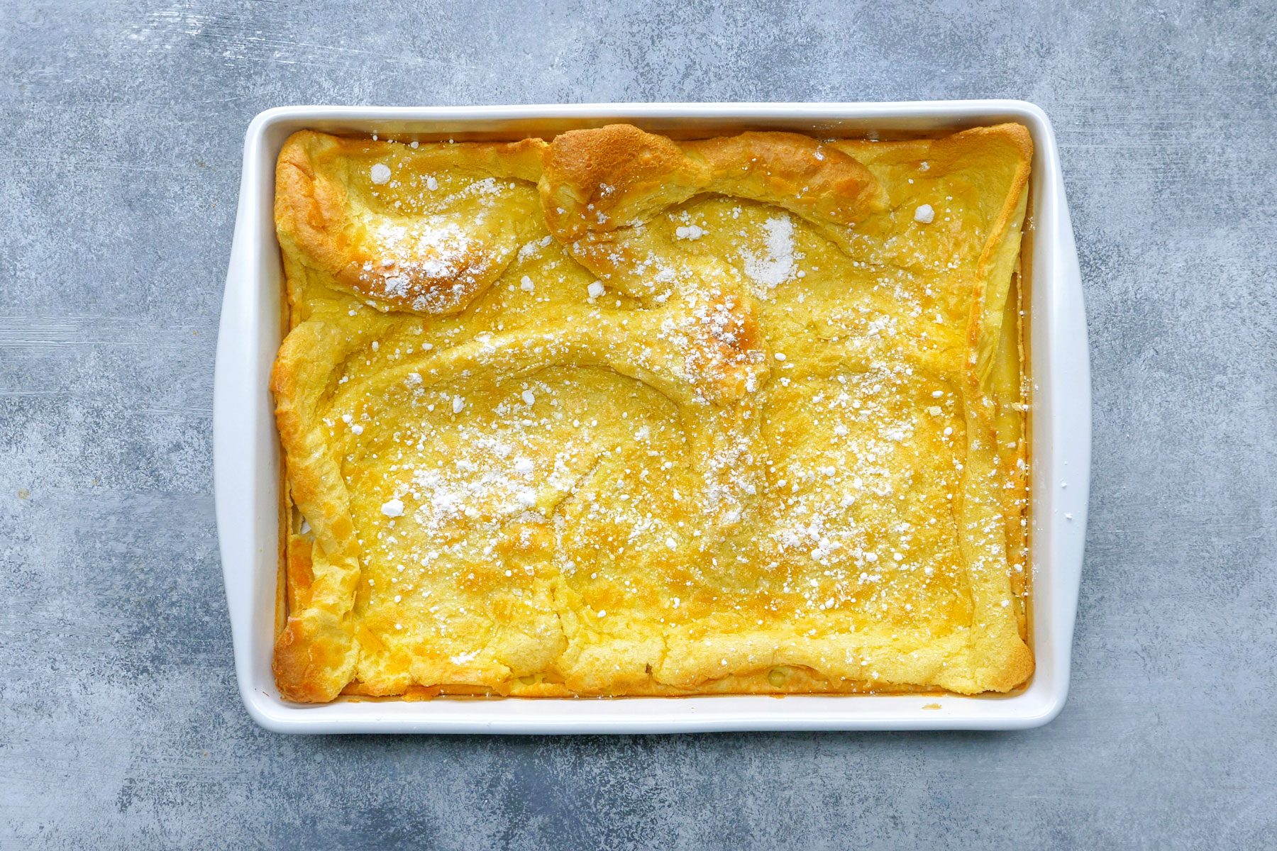 over head shot of German Pancakes with added confectioners' sugar