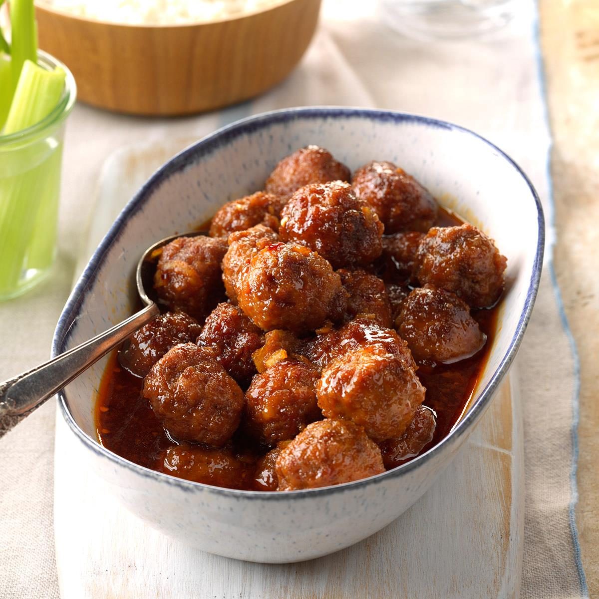 A bowl full of meatballs in honey buffalo sauce