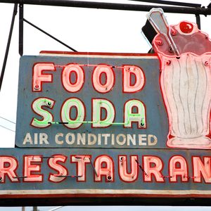 Original neon sign for a fast casual restaurant in Nashville that features ice cream sodas.;