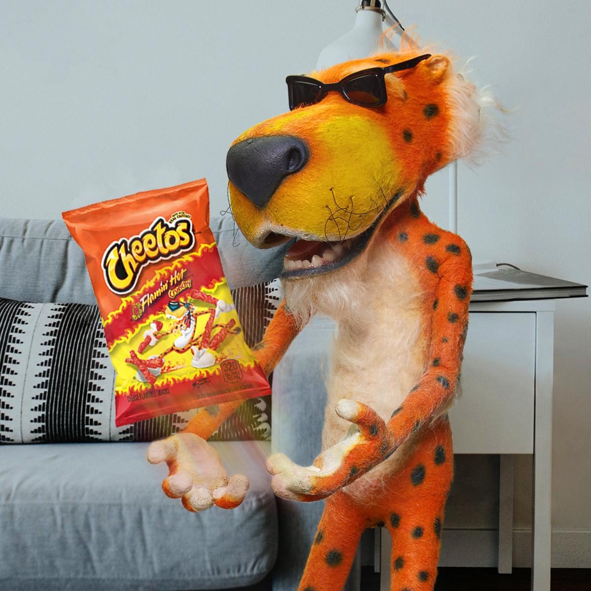 chester cheetah with flaming hot cheetos