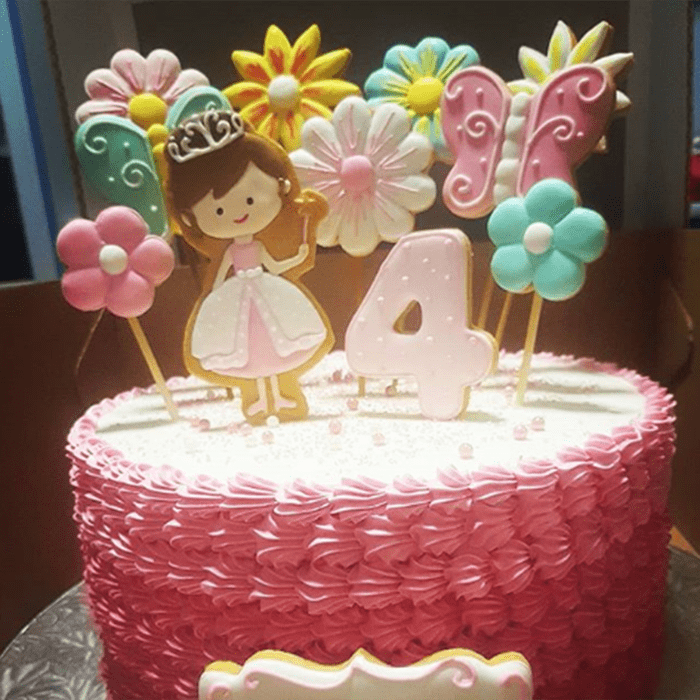 Cool cookies poking out of the top of a pink cake