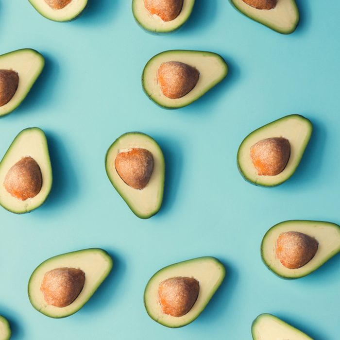 Avocado colorful pattern on a pastel blue background.