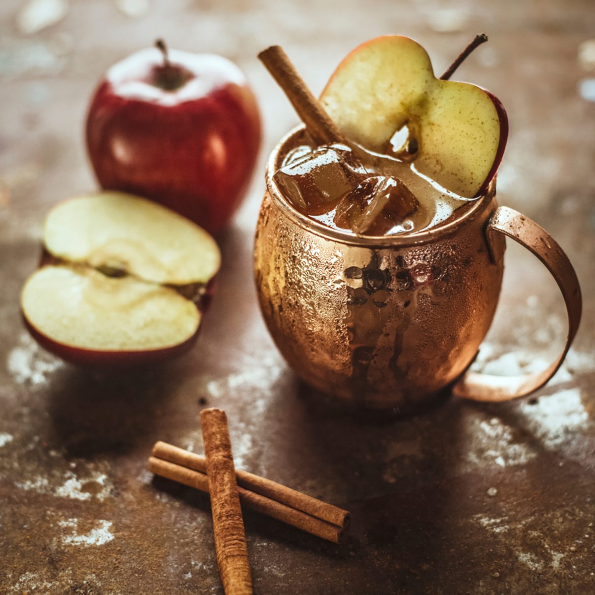 Icy Cold Moscow Mule cocktail with Ginger Beer, Vodka, apple and cinnamon