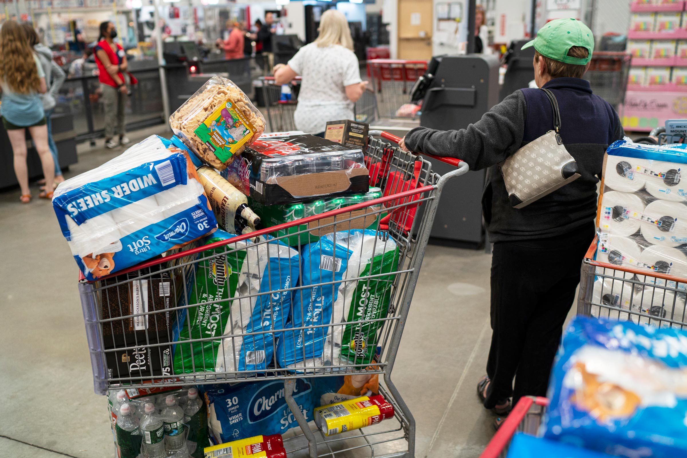 woman with a filled cart at Costco