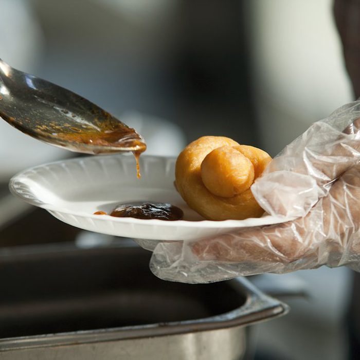 Handing out sauce and roll