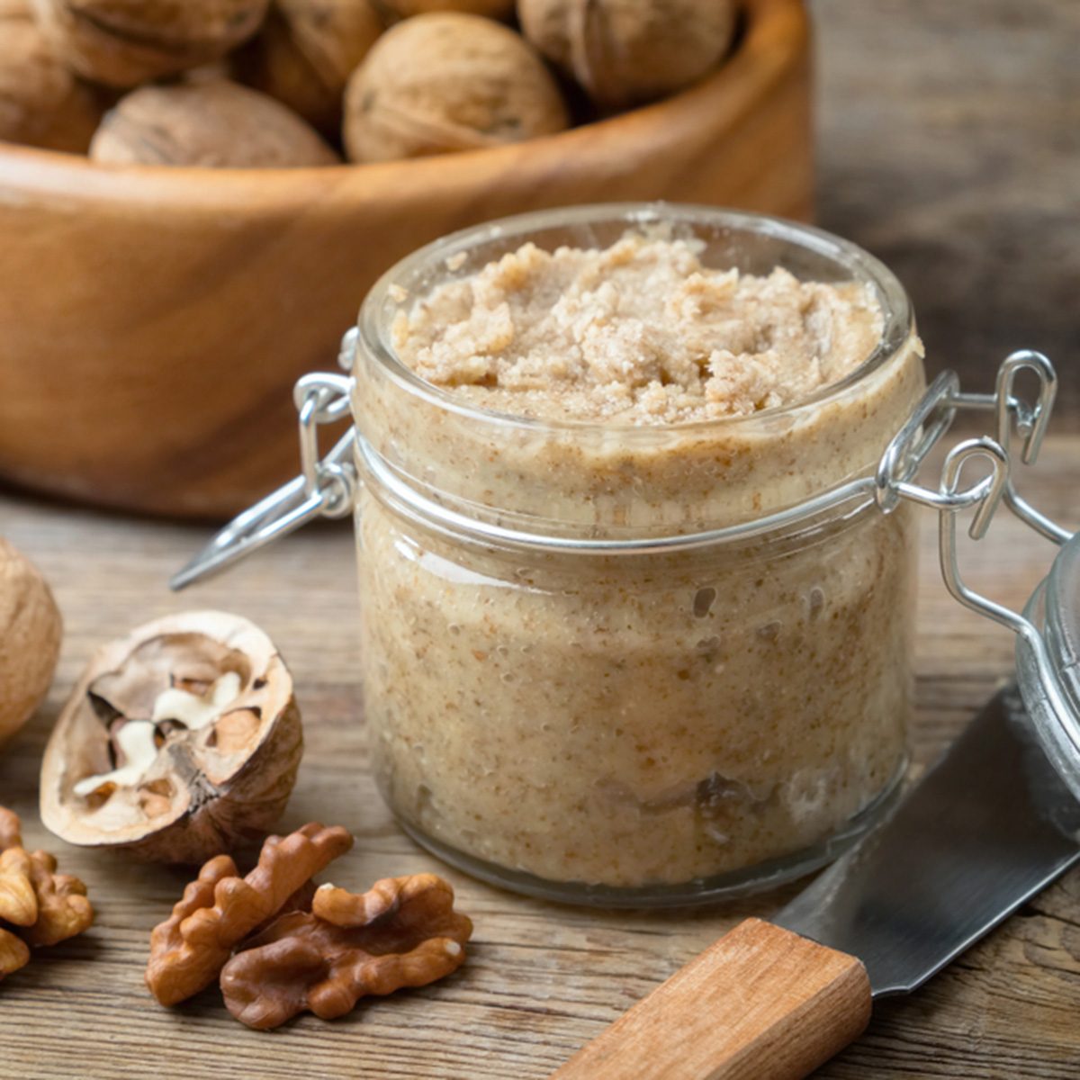Raw organic walnut butter and fresh nuts.