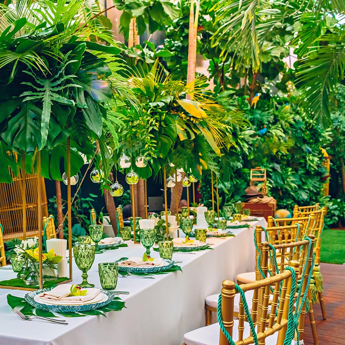 Served table at a tropical party decorated with orchids