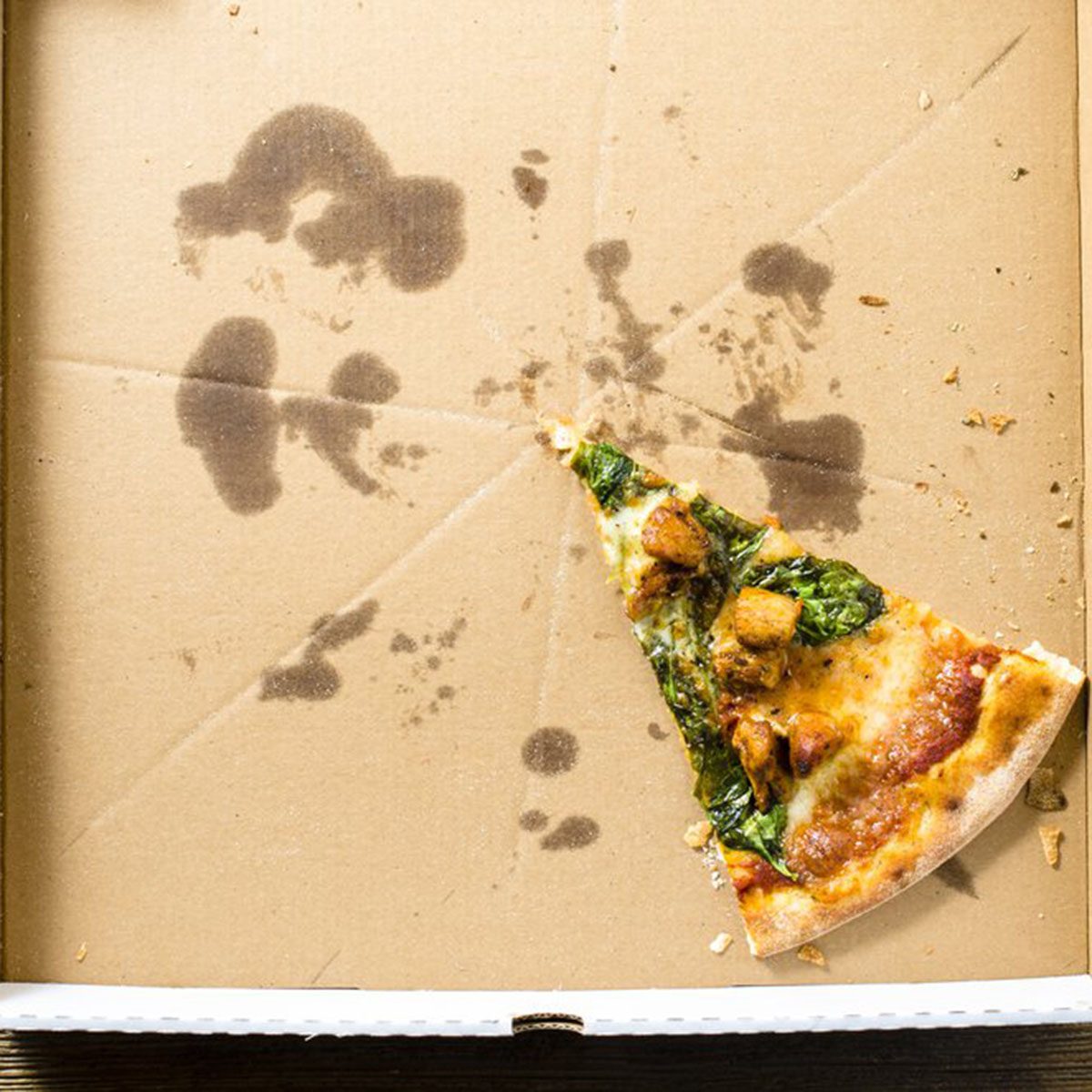 One slice of pizza left in the box