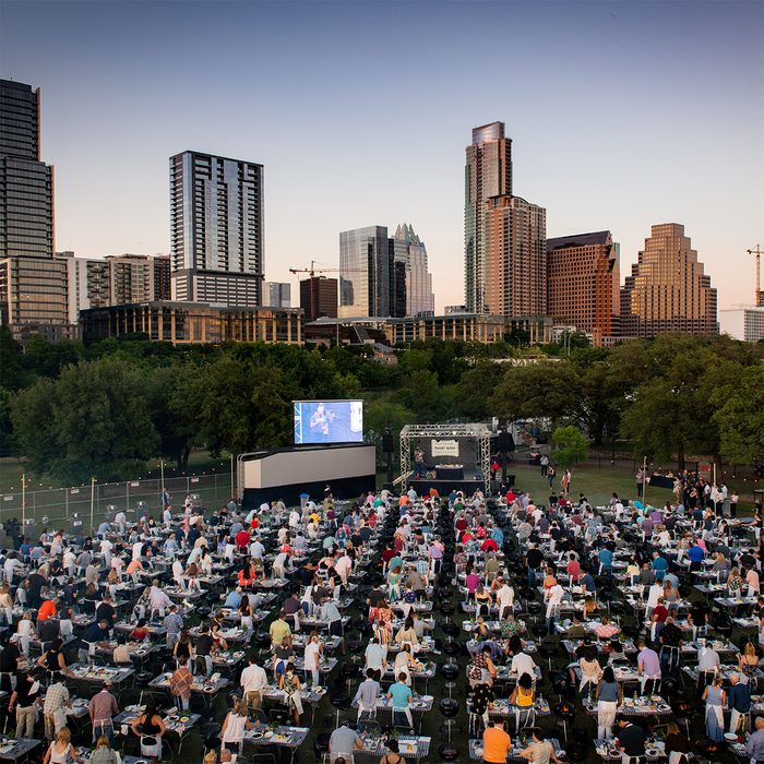 Austin Food + Wine Festival rows of people cooking at tables in Austin texas park