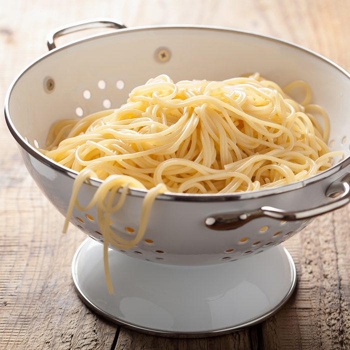 spaghetti in colander