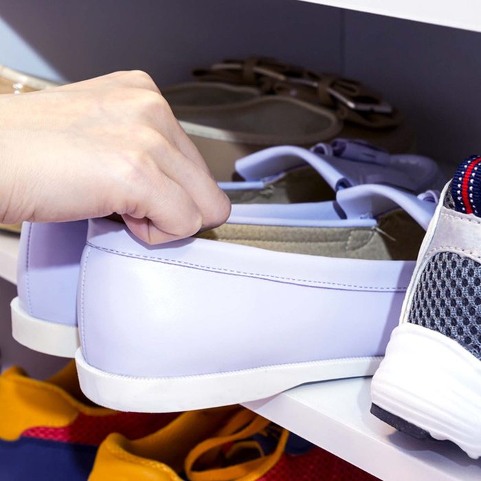 Picking up a pair of shoes