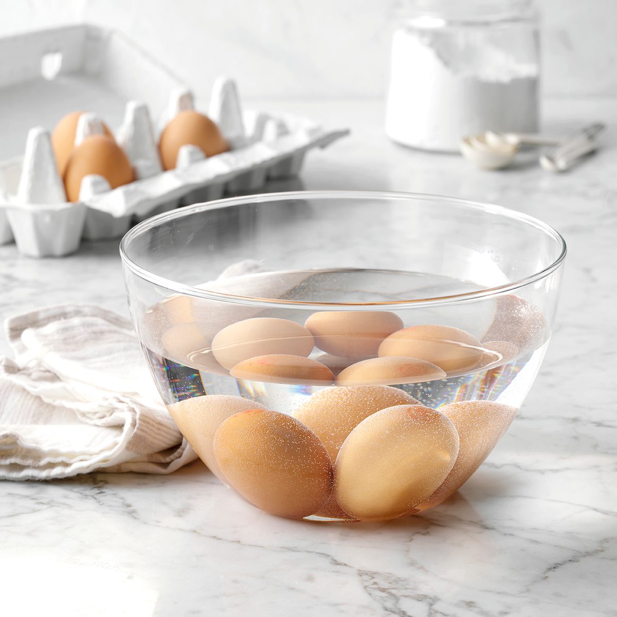 Eggs in bowl full of water