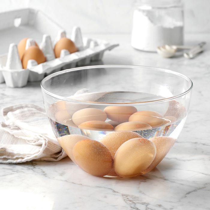 Eggs in bowl full of water