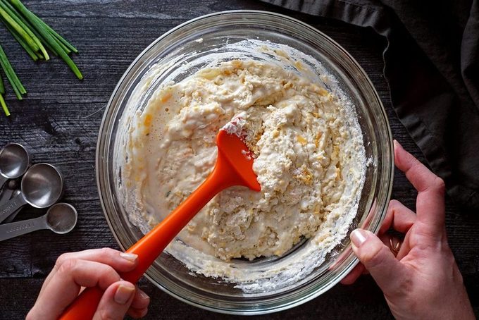 mixing cheddar bay biscuit dough in a bowl red lobster cheddar bay biscuits