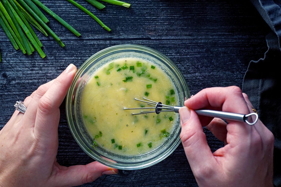mixing herb butter topping together for red lobster cheddar bay biscuits red lobster cheddar bay biscuits