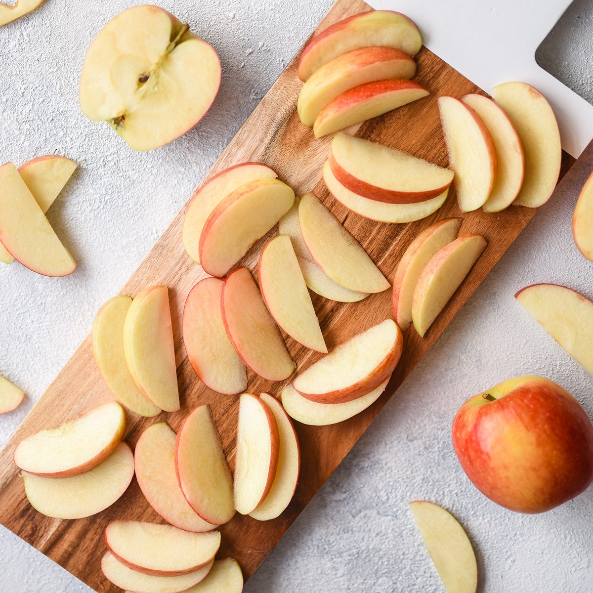 Sliced Apples on a Wooden Chopping Board; Shutterstock ID 1370470283; Job (TFH, TOH, RD, BNB, CWM, CM): TOH