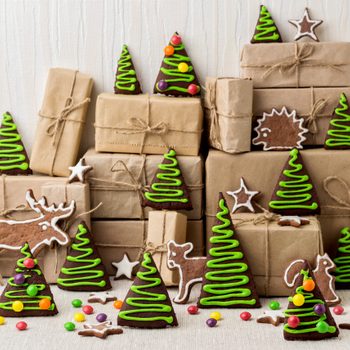 New Year's and Christmas gingerbread trees (ginger and honey cookies) decorated with green glaze and coloured dragee.