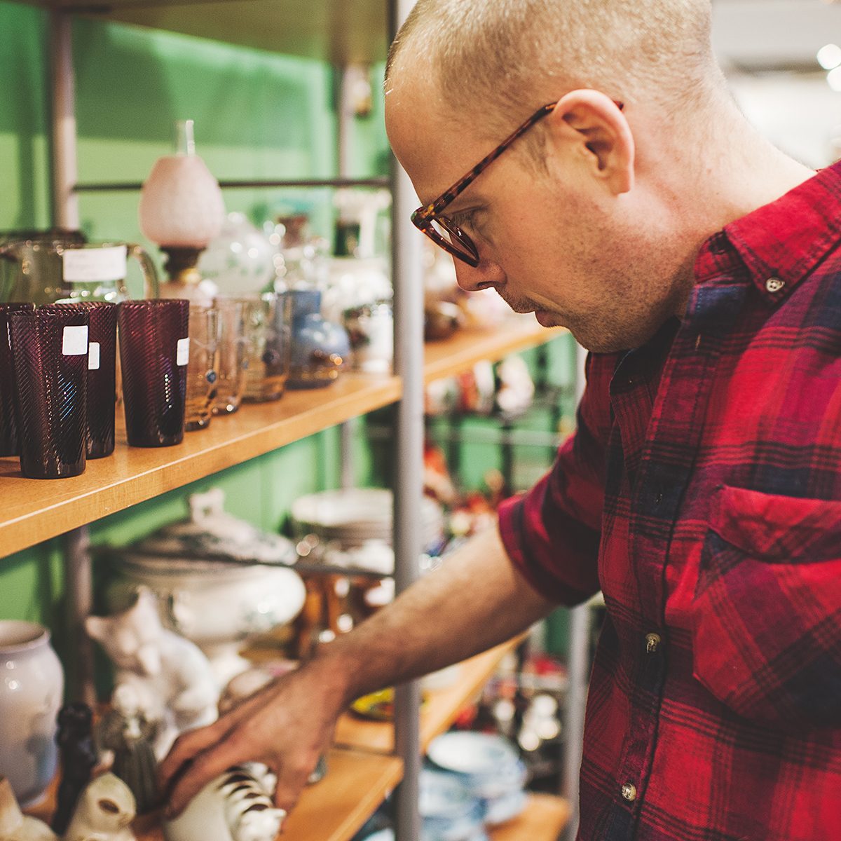 Man in thrift shop - second hand store