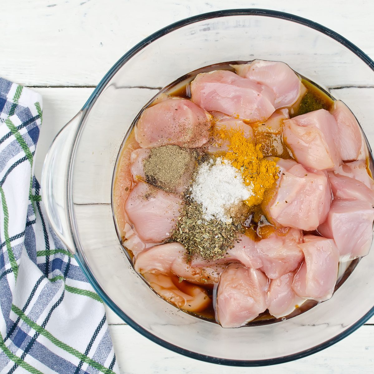 Raw pieces of chicken marinated in spices. Step-by-step cooking