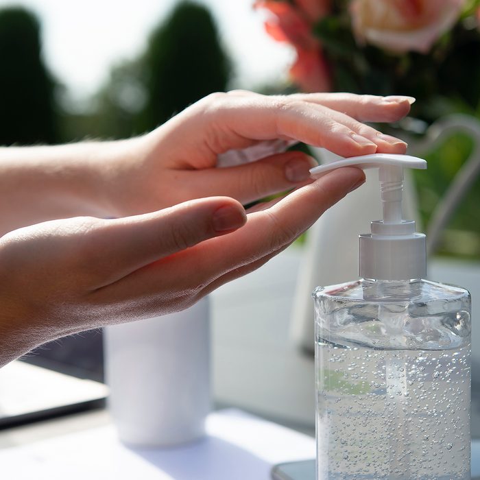 COVID-19 Pandemic in Australia. Young woman working at home in isolation, in an Australian setting. Sunny afternoon, working in an isolated environment with her Laptop and iPhone.