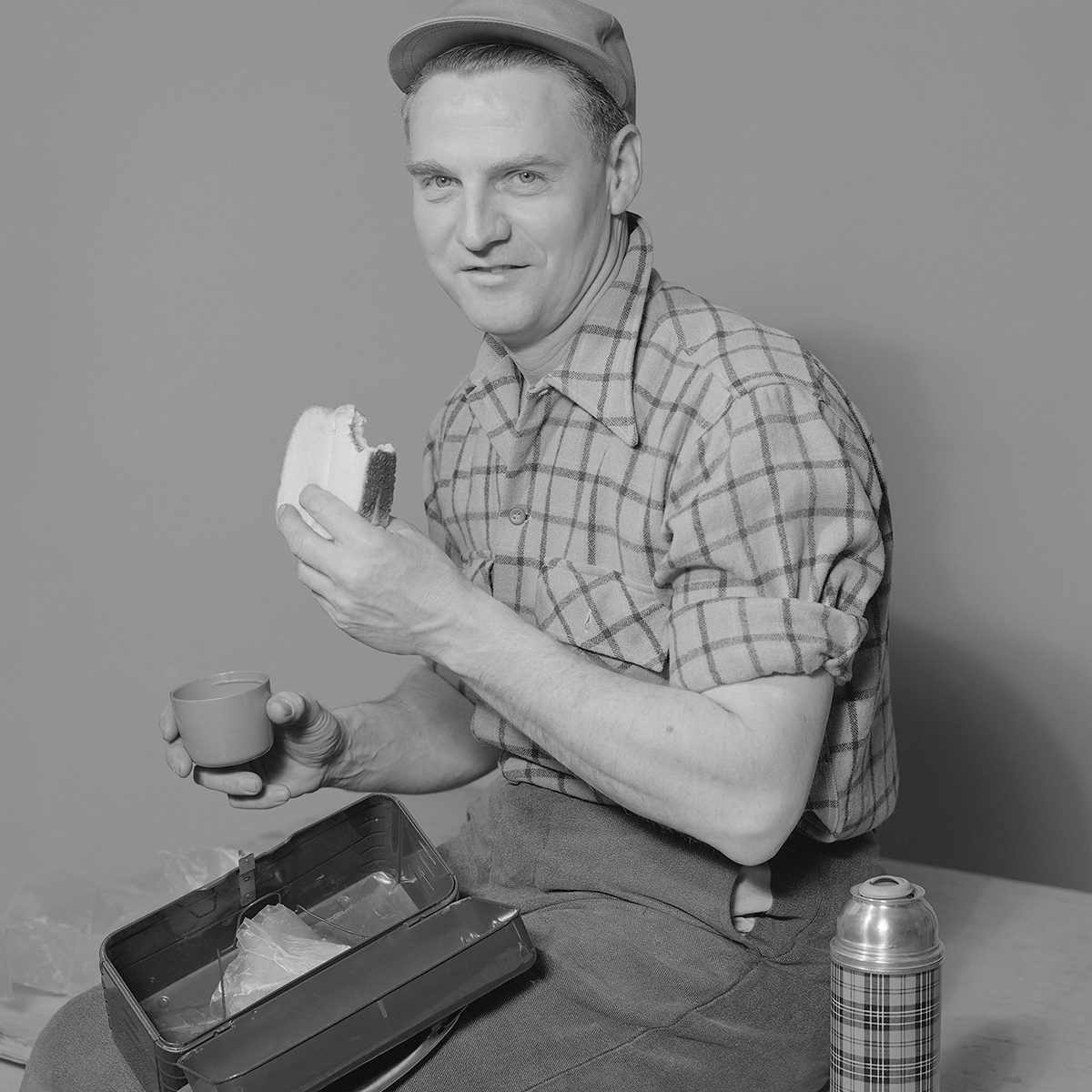 Portrait Of Man Eating Bread Slice. (Photo by Lambert/Getty Images)