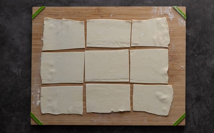 Rectangles of puff pastry dough on a cutting board. starbucks cheese danish copycat