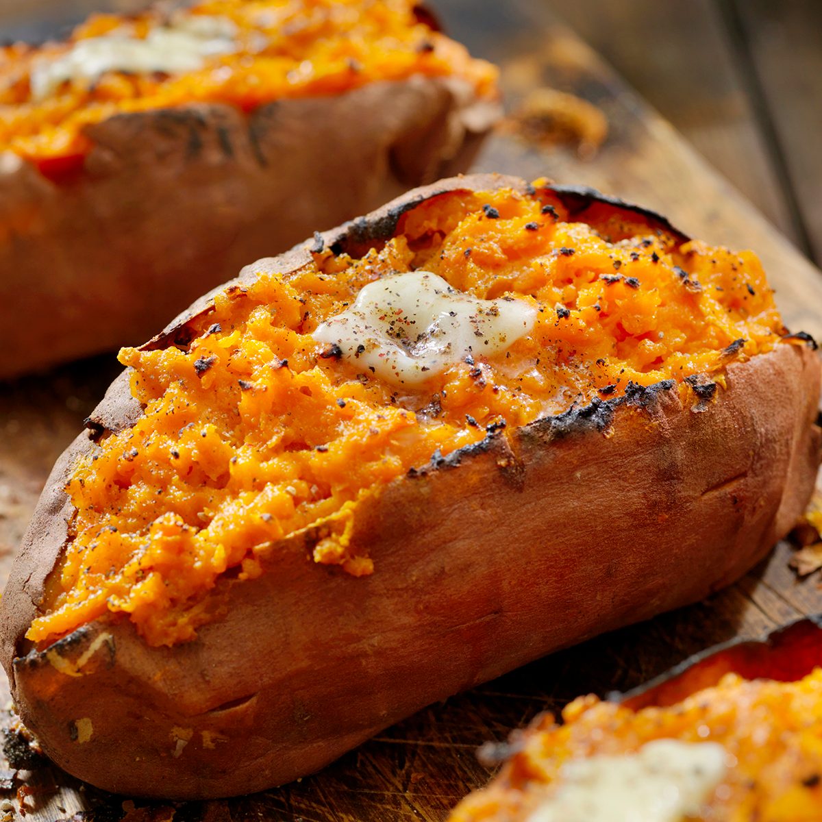 Twice Baked, Stuffed Sweet Potatoes with Melting Butter and Cracked Pepper