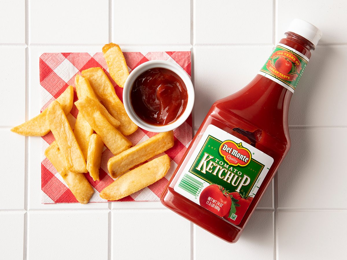 Overhead Shot Of Del Monte Ketchup In Bottle With Fries.