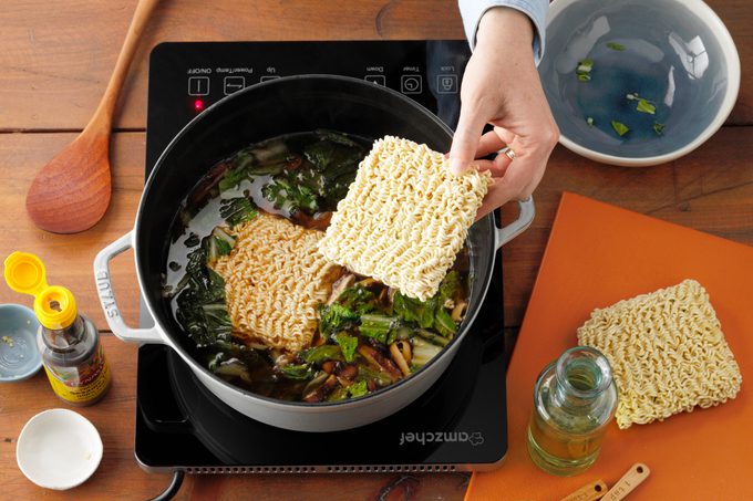 Pork Ramen with noodles being added