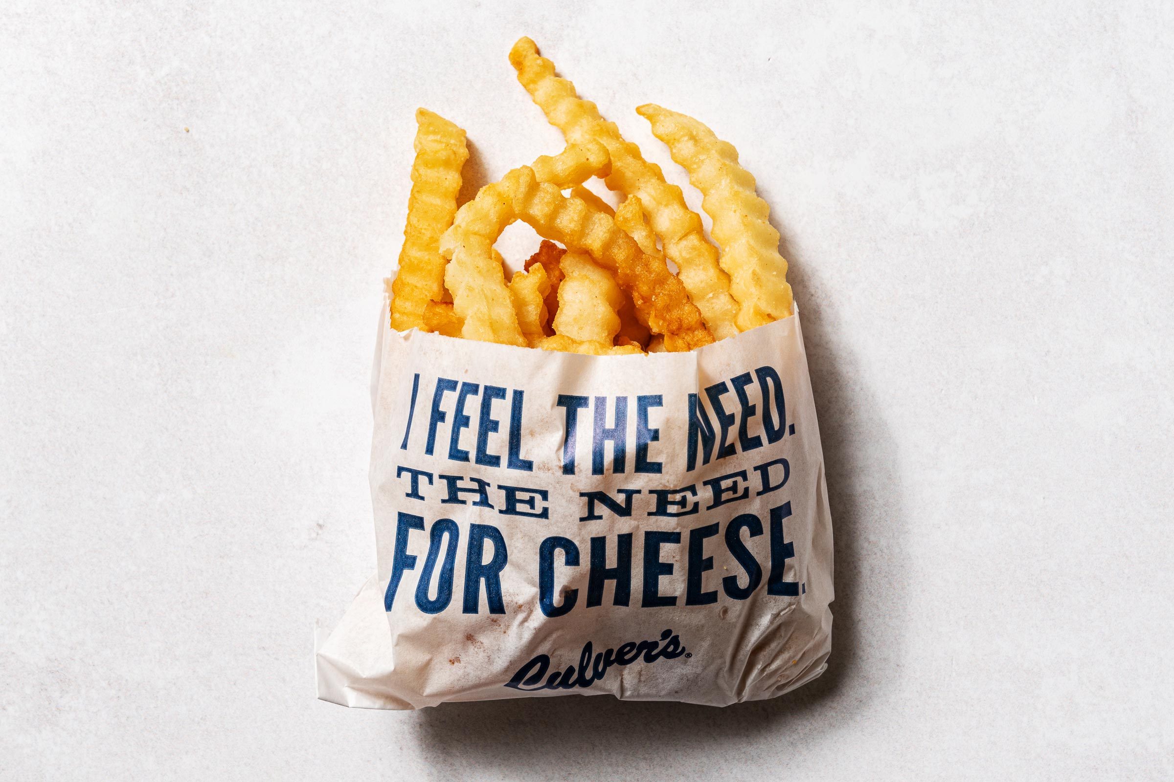 Culvers crinkle fries in a wax bag that says 