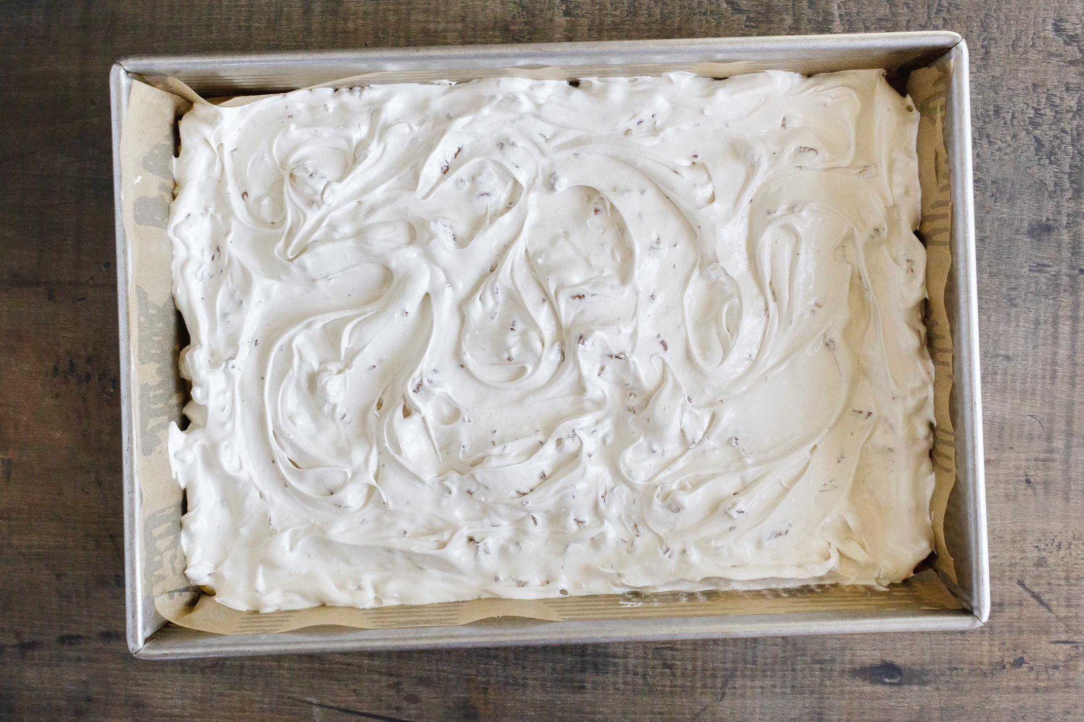delta bars in a pan before baking