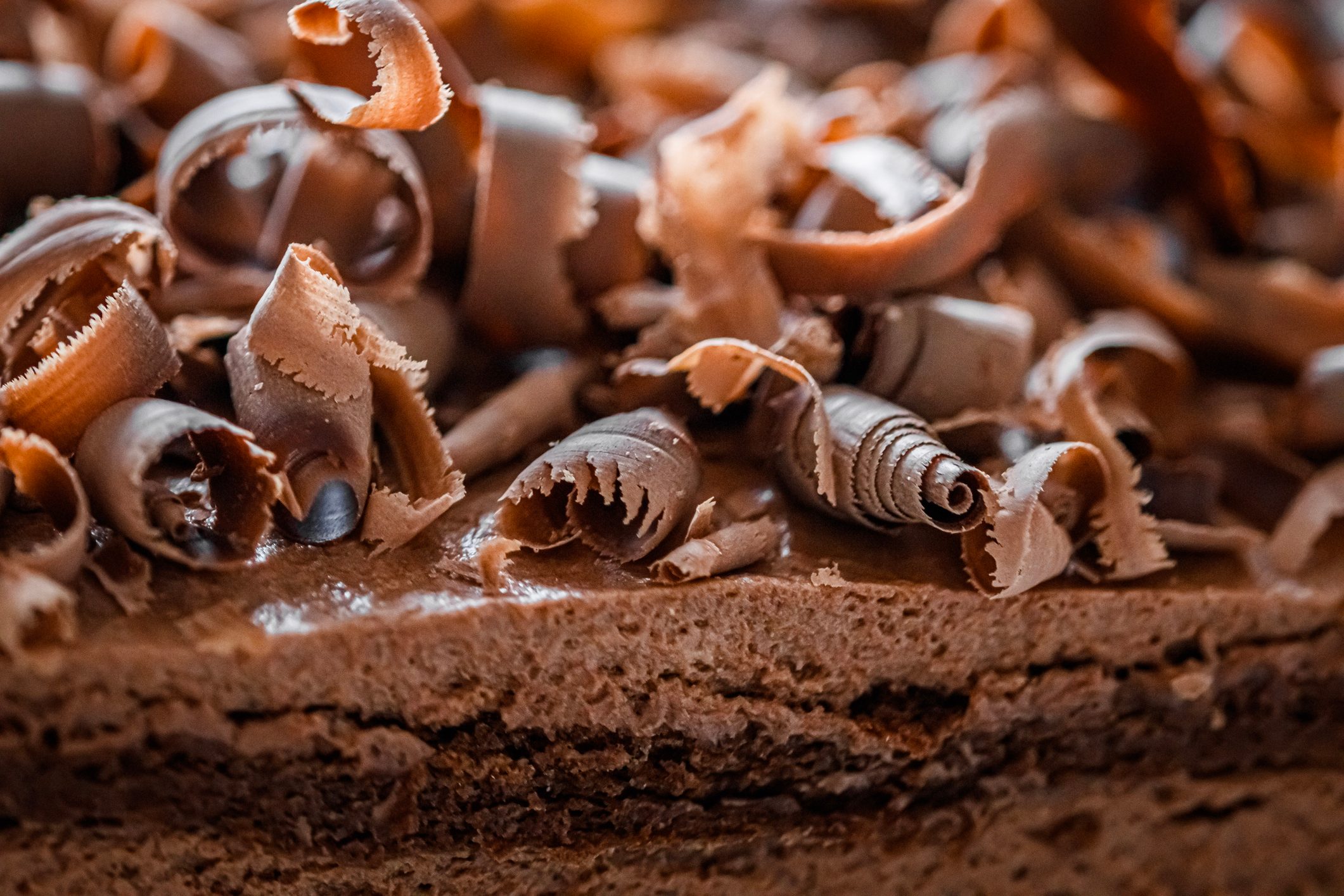 Close-up of chocolate cakes and chocolate with shavings on top