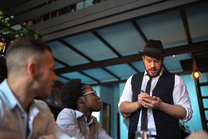 Waiter taking client