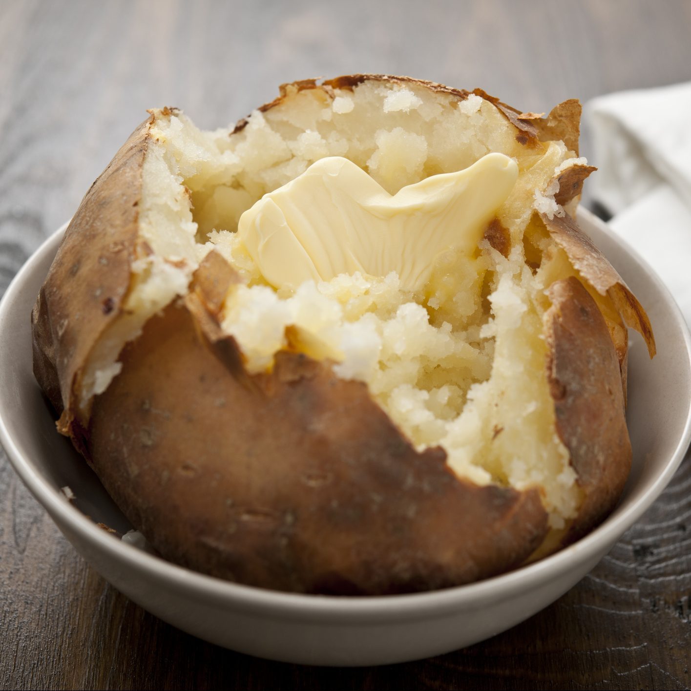 Baked potato with melting butter