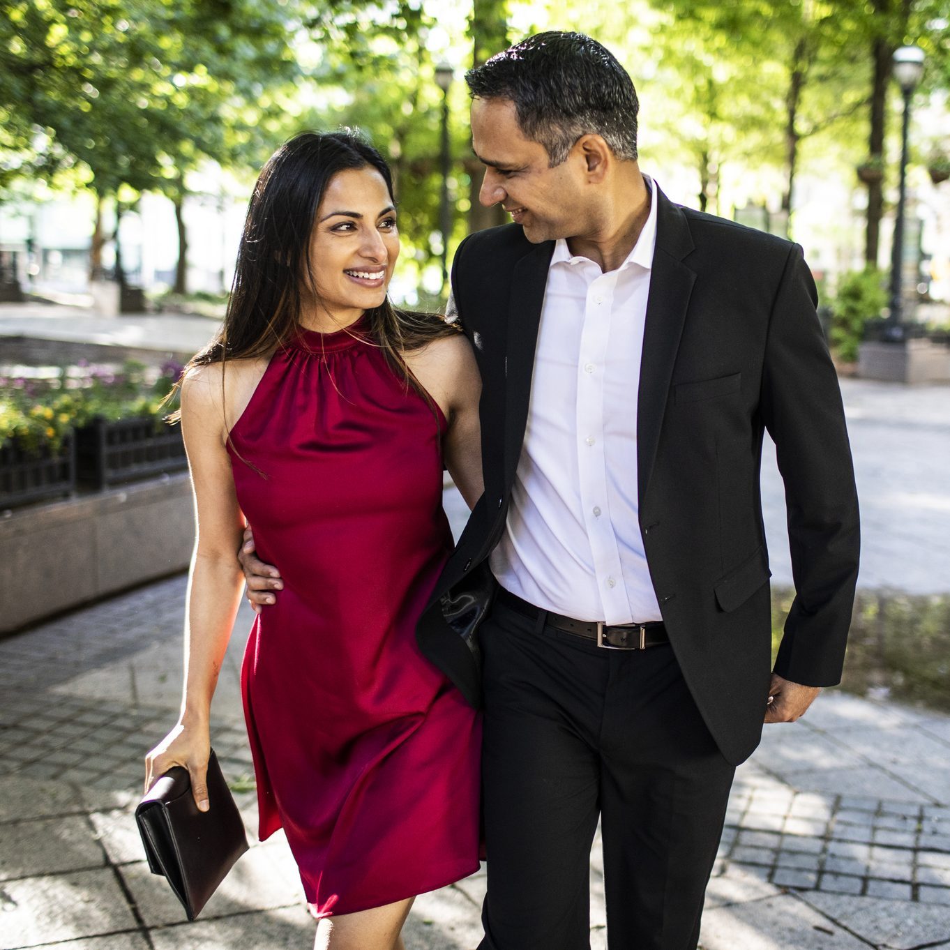 Married couple strolling through downtown park