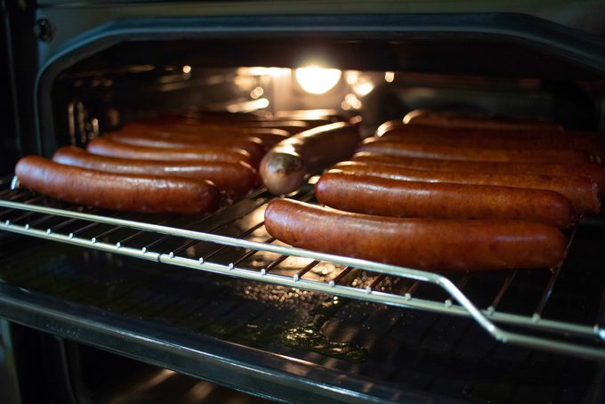 Cooking hotdogs in the oven.