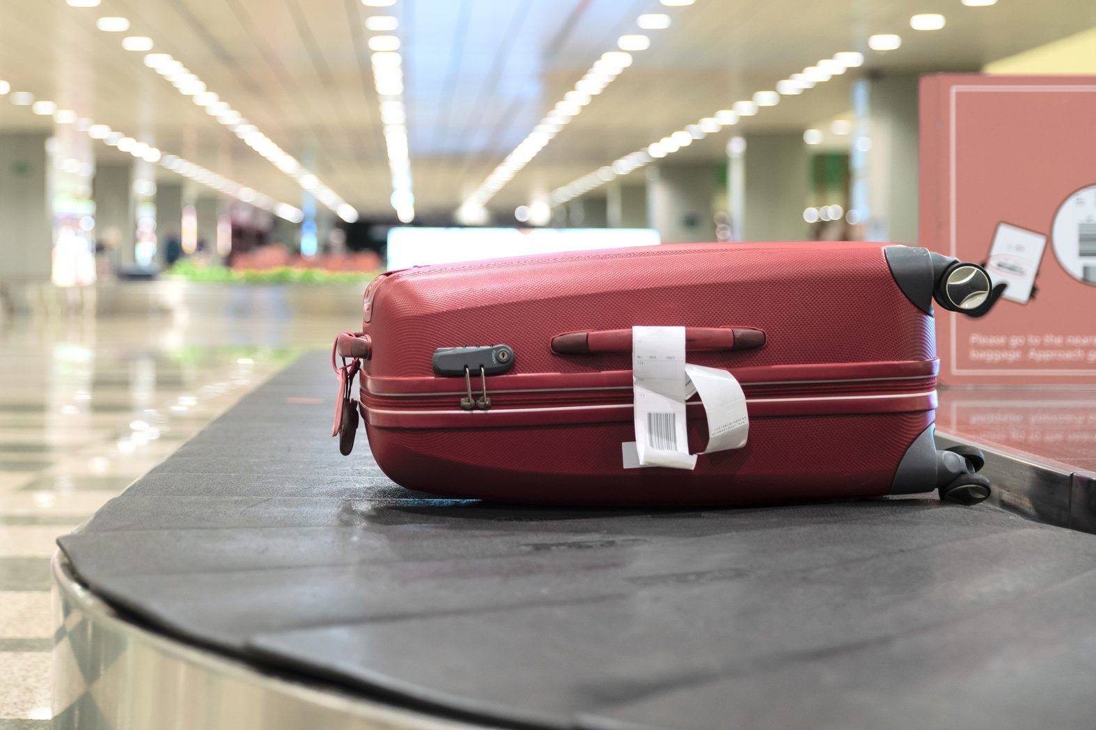 Luggage On Conveyor Belt At Airport