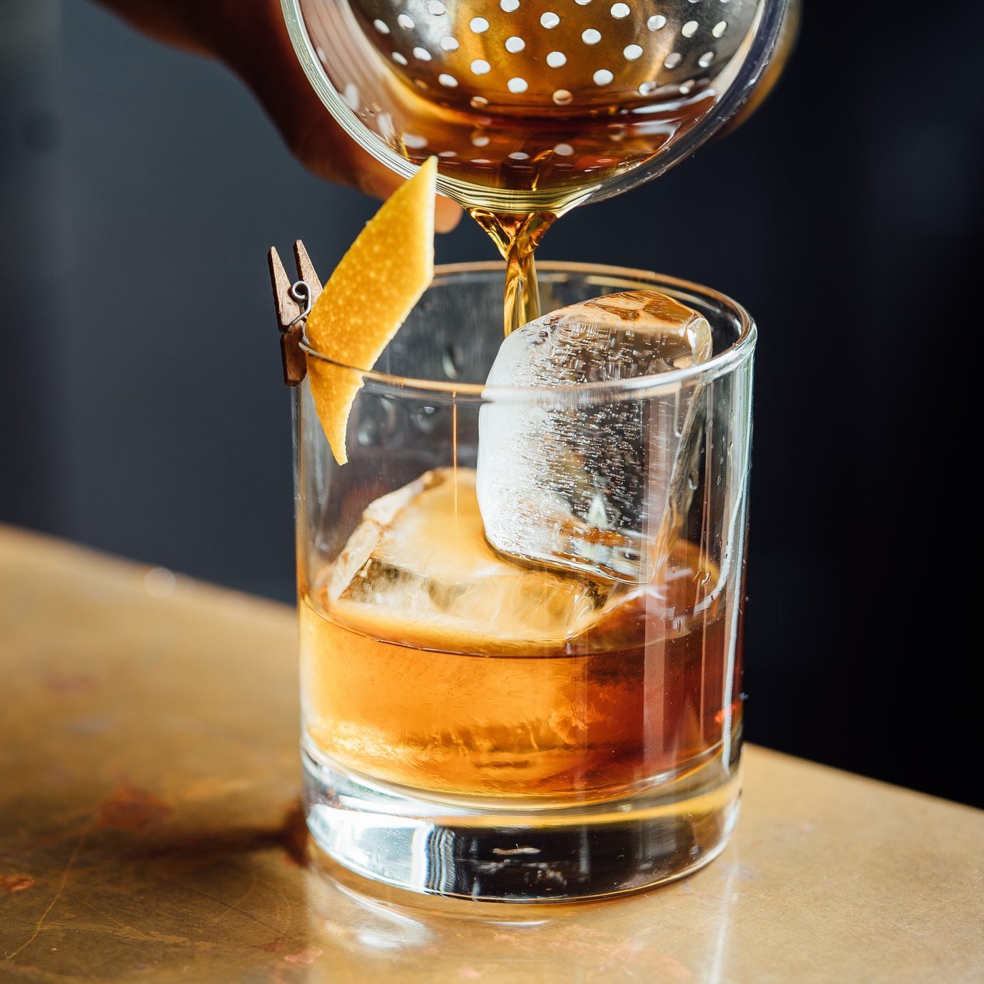 Closeup Glass with Alcohol in Cocktail Bar