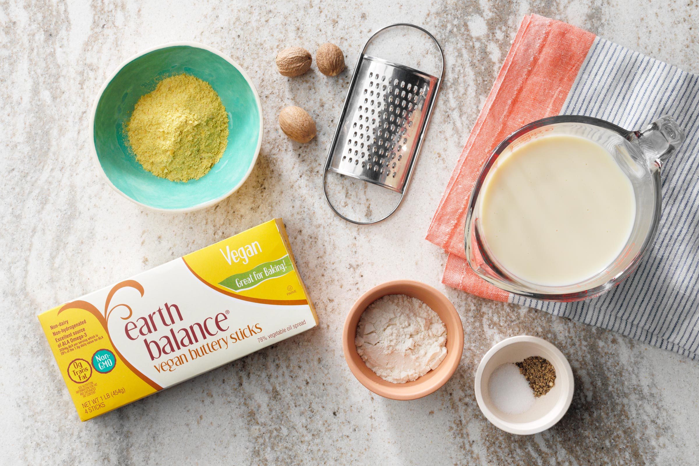 ingredients for béchamel sauce on a kitchen counter