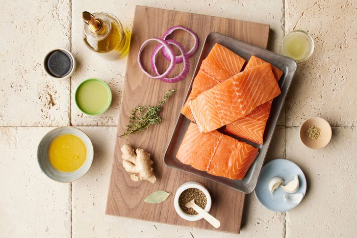 raw salmon and ingredients for making a marinade