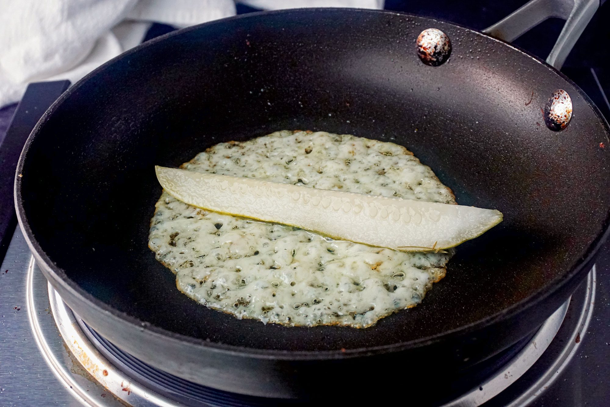 Pickle and Cheese Slice frying in pan
