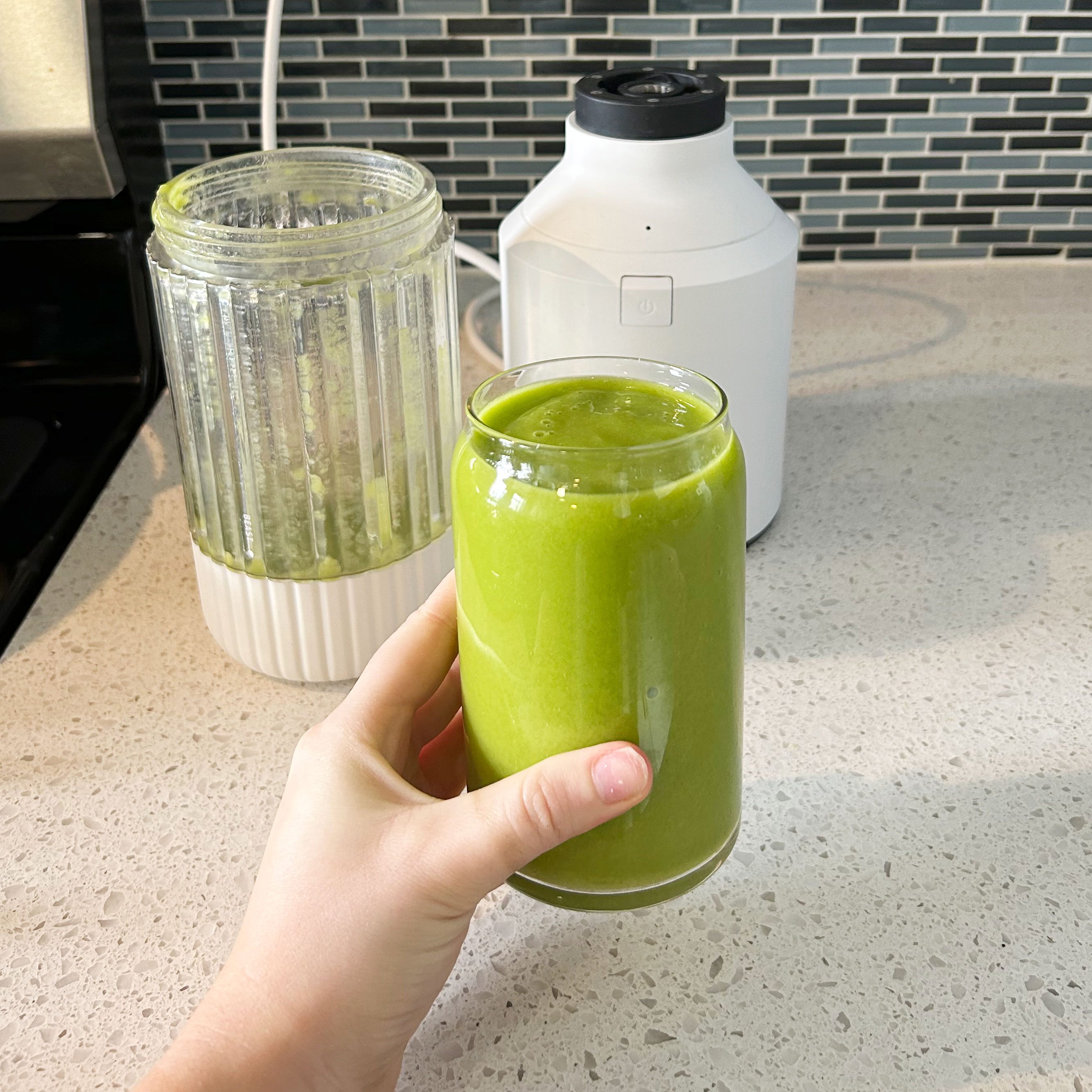 green smoothie in a clear glass cup