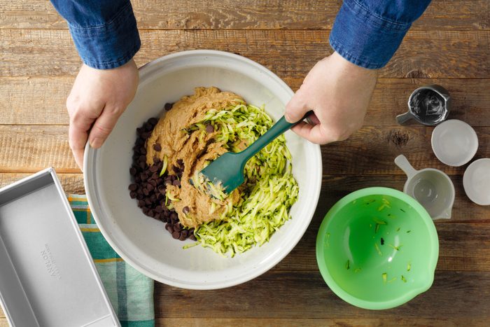 mixing ingredients in a bowl for gluten free zucchini bread, top view