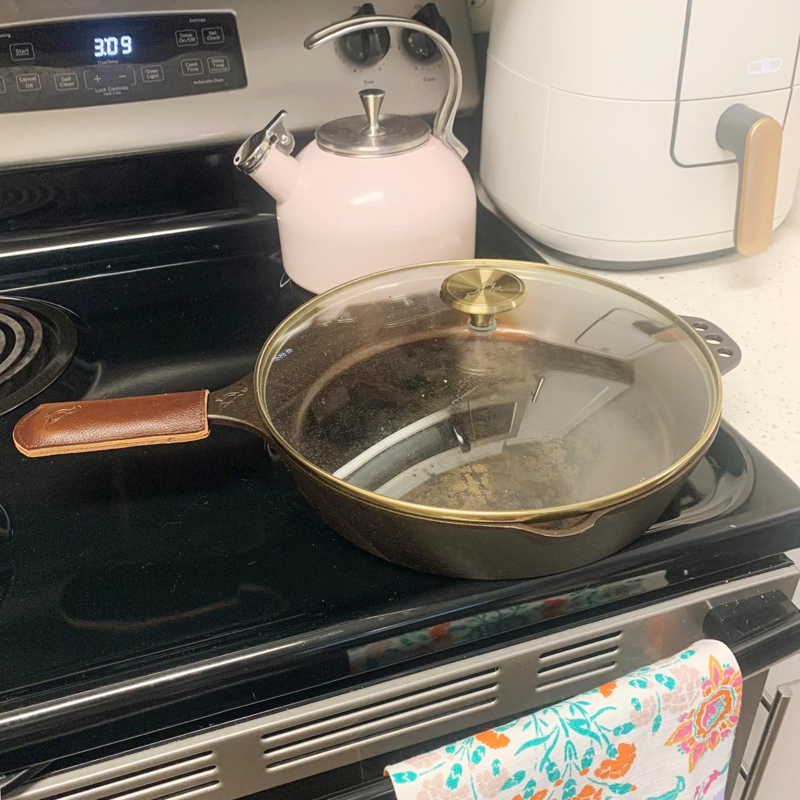 Smithey Cast Iron Skillet with lid on stove