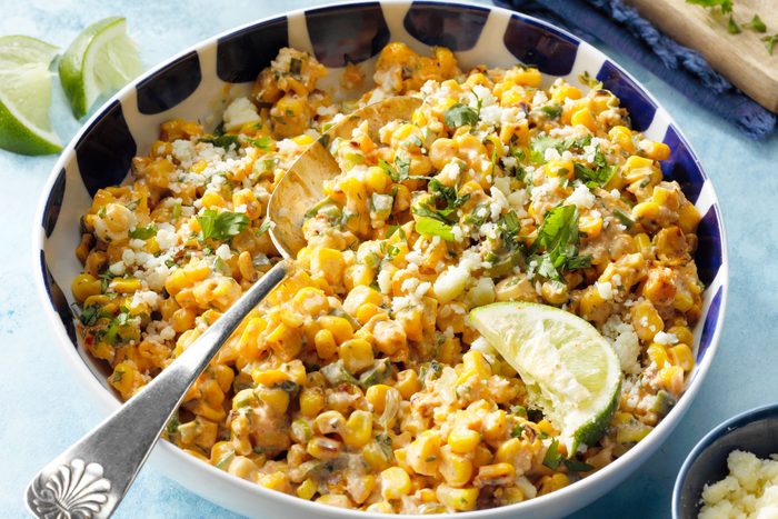 Mexican Street Corn Esquites in bowl with serving spoon