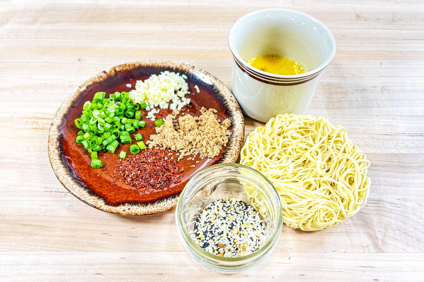 Tiktok Ramen ingredients laid out on wood surface