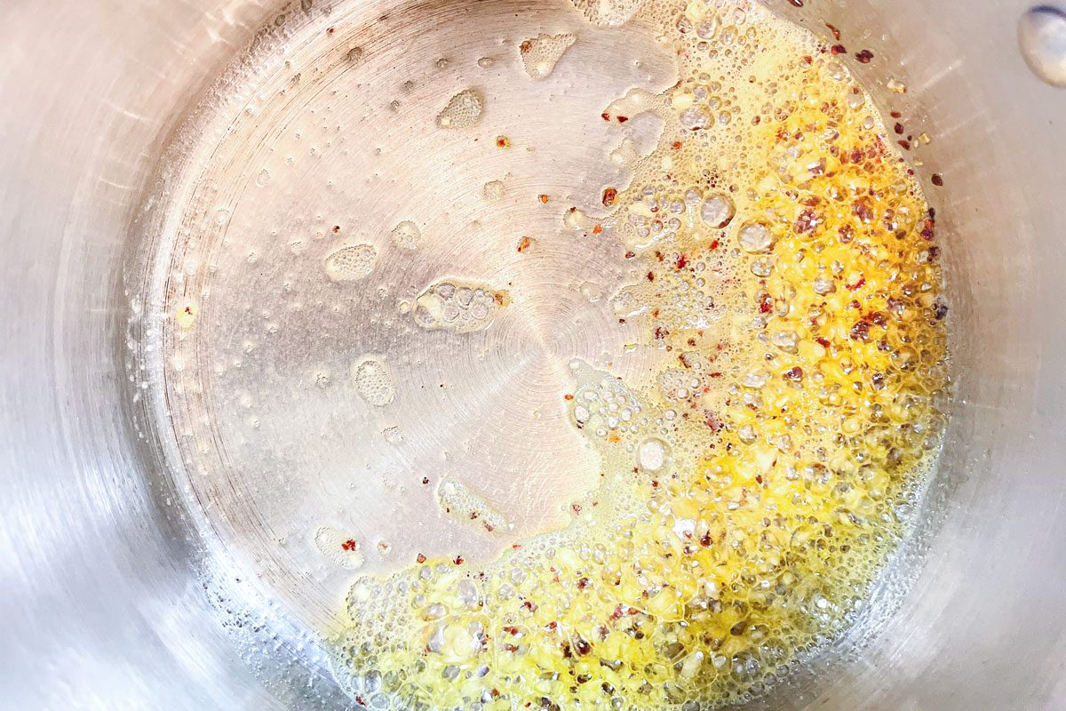 butter, minced garlic, and red pepper flakes in a pan for Tiktok Ramen