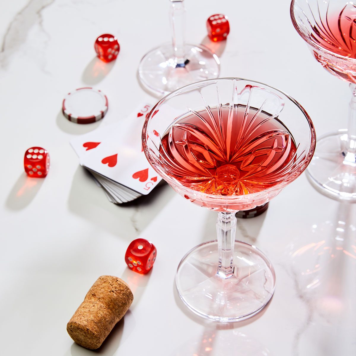 Deck Of Cards, Glasses Of Cocktail, Dice, Casino Token And Cork