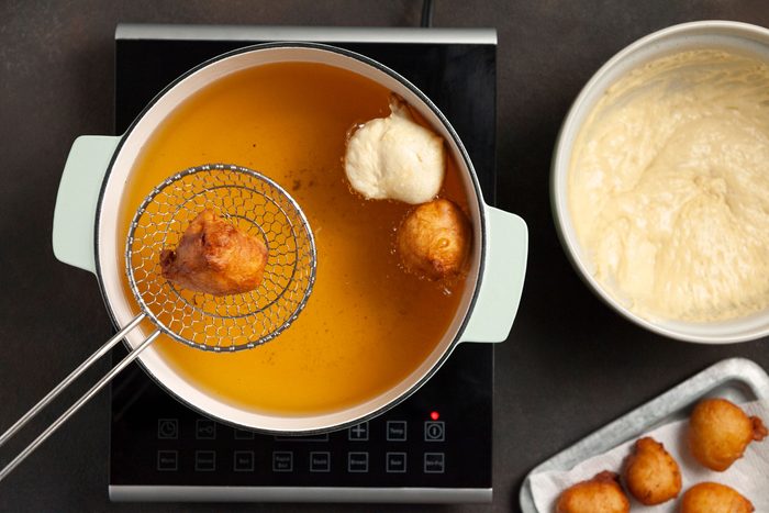 How To Make Zeppole Italian Doughnuts frying the zeppole